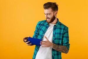 stylish young man holding wireless speaker photo