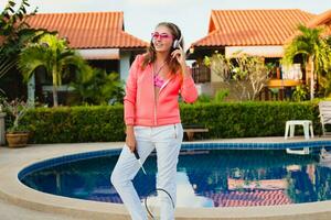 attractive woman doing sports at pool photo