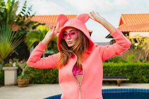 attractive woman in colorful pink hoodie photo