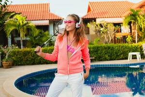 attractive woman doing sports at pool photo