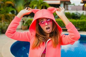 attractive woman in colorful pink hoodie photo