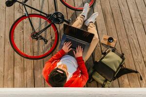 handsome bearded man traveling with bicycle in morning photo