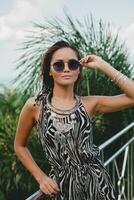 young asian sexy beautiful woman in tropical dress, zebra print photo