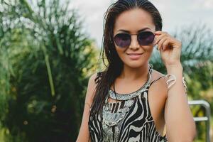 young asian sexy beautiful woman in tropical dress, zebra print photo