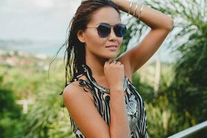 young asian sexy beautiful woman in tropical dress, zebra print photo