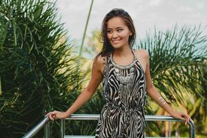 young asian sexy beautiful woman in tropical dress, zebra print photo