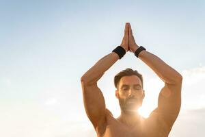 attractive hansome man with athletic strong body doing morning yoga dzen meditation photo