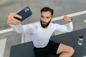 athletic strong hansome man on morning fitness workout exercise photo