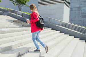 young hipster woman in pink coat photo