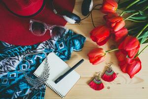 woman's accessories flat lay with red tulips photo