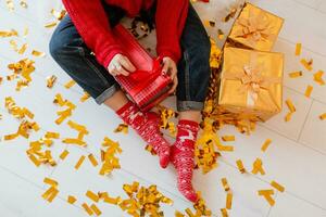 pretty woman at christmas tree with presents photo