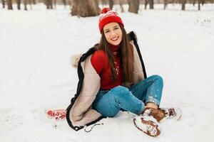 smiling woman having fun in winter park photo