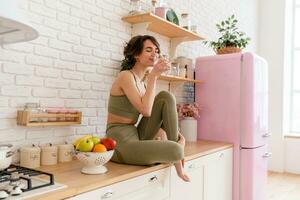 healthy slim woman in kitchen in the morning, diet food wellness photo