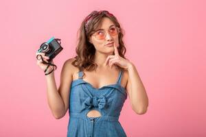 attractive smiling happy woman posing with vintage photo camera