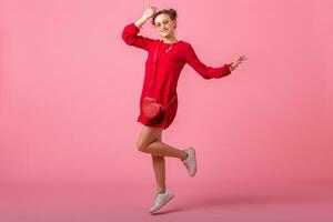 attractive happy smiling stylish woman in red trendy dress photo