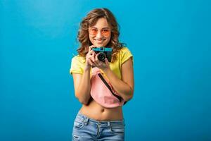 attractive smiling happy woman posing with vintage photo camera