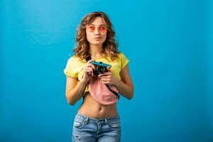 attractive smiling happy woman posing with vintage photo camera