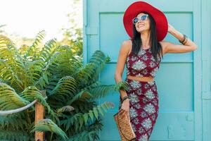stylish beautiful woman in printed outfit, summer style fashion photo