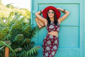 stylish beautiful woman in printed outfit, summer style fashion photo