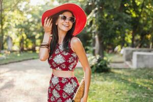 stylish woman in printed outfit, summer style photo