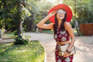 stylish woman in printed outfit, summer style photo