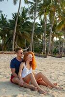 young couple in love happy on summer beach together having fun photo