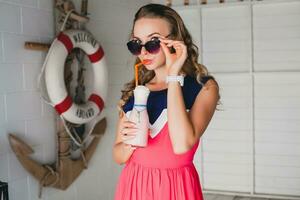 young stylish beautiful woman in cafe photo