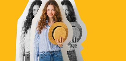 young attractive stylish woman sitting at wall background, straw hat photo