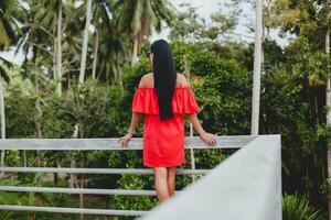 young stylish woman in red summer dress photo