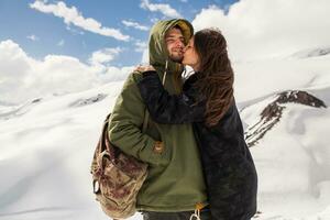 young beautiful hipster couple hiking in mountains photo