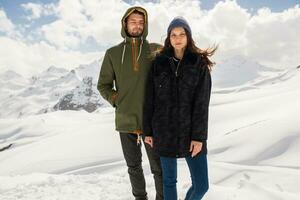 young beautiful hipster couple hiking in mountains photo