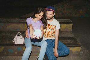 young stylish hipster couple in love, swag outfit photo