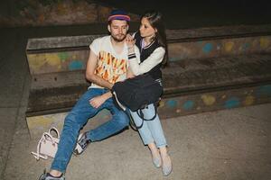young stylish hipster couple in love, swag outfit photo