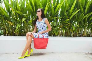 young stylish beautiful woman in blue printed dress summer style photo