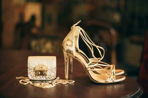 luxury fashion woman accessories, golden heeled shoes photo