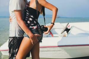 happy hipster woman and man on summer tropical vacation photo