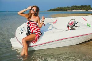 happy woman wrapped in american flag photo