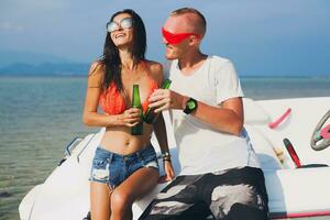 happy hipster woman and man on summer tropical vacation photo