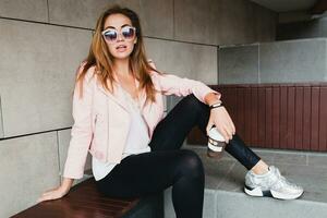 young beautiful stylish hipster woman in pink leather jacket photo