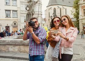 young hipster company of friends traveling, vintage style, europe vacation photo