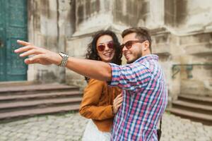 young couple in love traveling, vintage style, europe vacation photo