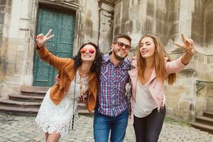 young hipster company of friends traveling, vintage style, europe vacation photo