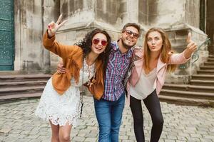 young hipster company of friends traveling, vintage style, europe vacation photo