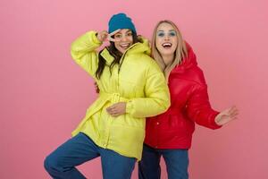 pretty women friends in colorful coat photo