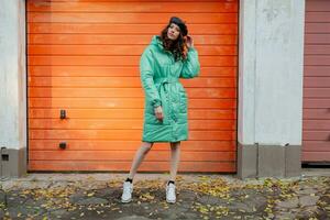 stylish woman in winter autumn fashion trend puffer coat photo