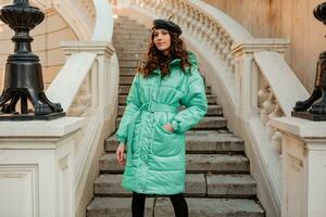 stylish woman in winter autumn fashion trend puffer coat photo