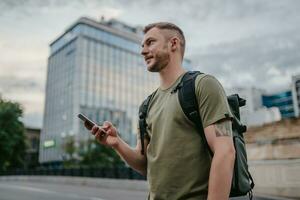 handsome hipster man walking in street photo