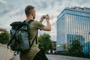 handsome hipster man walking in street photo