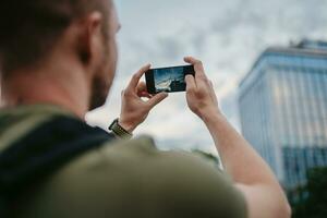 handsome hipster man walking in street photo