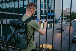 handsome hipster man walking in street photo